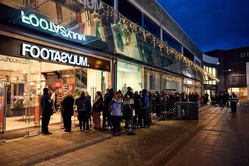 Queue outside the Footasylum store at night