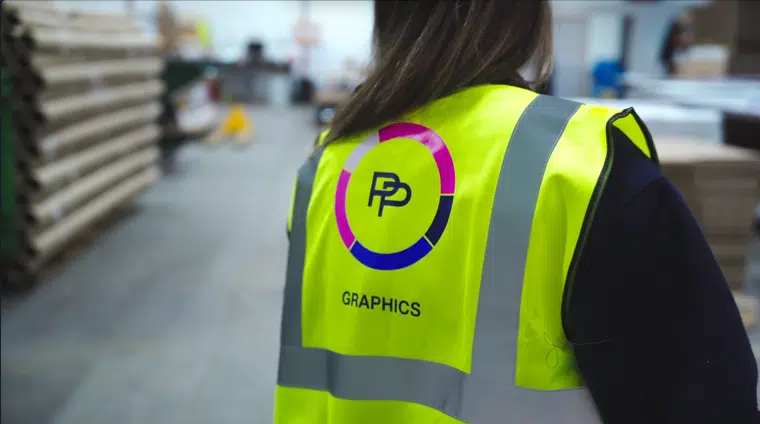 PP Graphics team member in branded hi-vis on the production floor