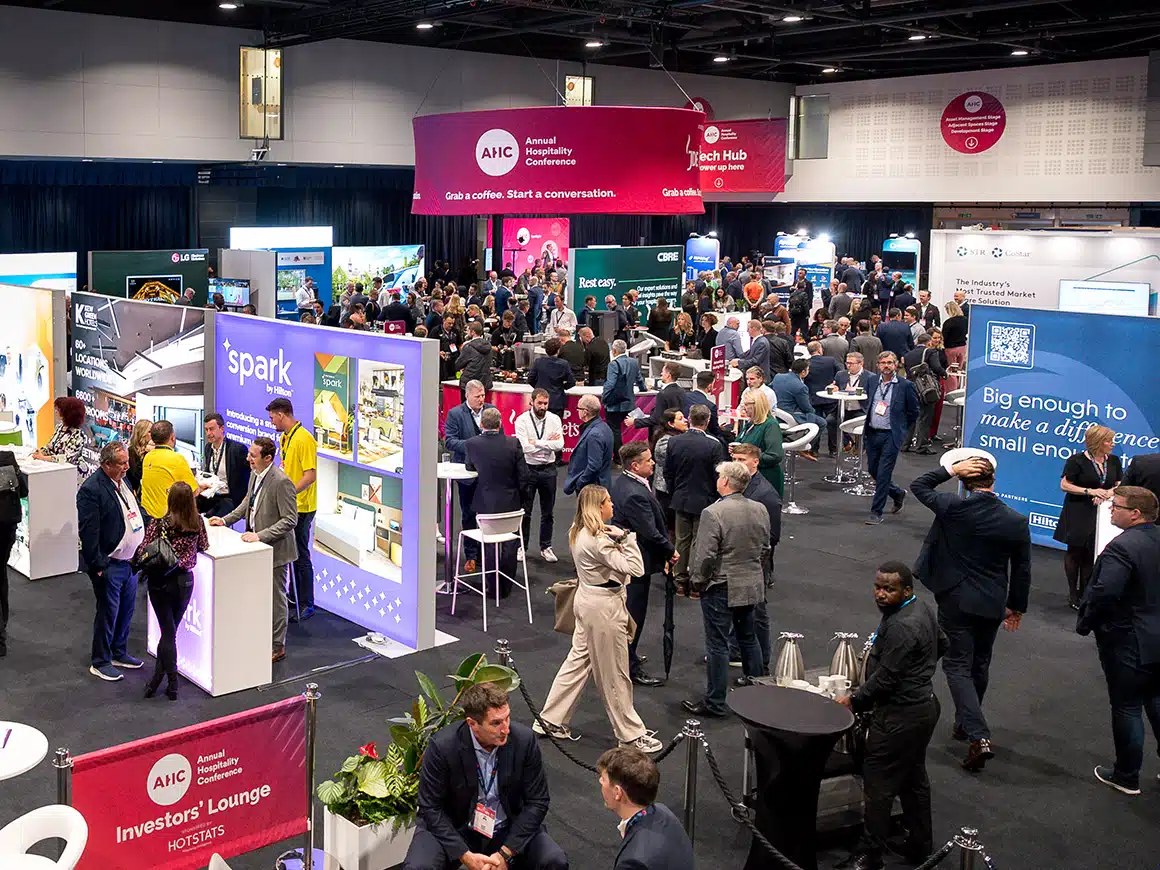Busy exhibition hall with printed stands