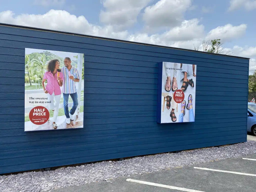 Cotton Traders store exterior with window graphics
