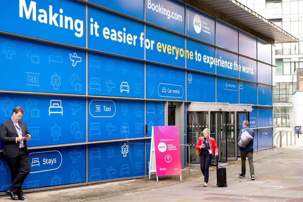 Booking.com branded building hoarding at the Annual Hospitality Conference