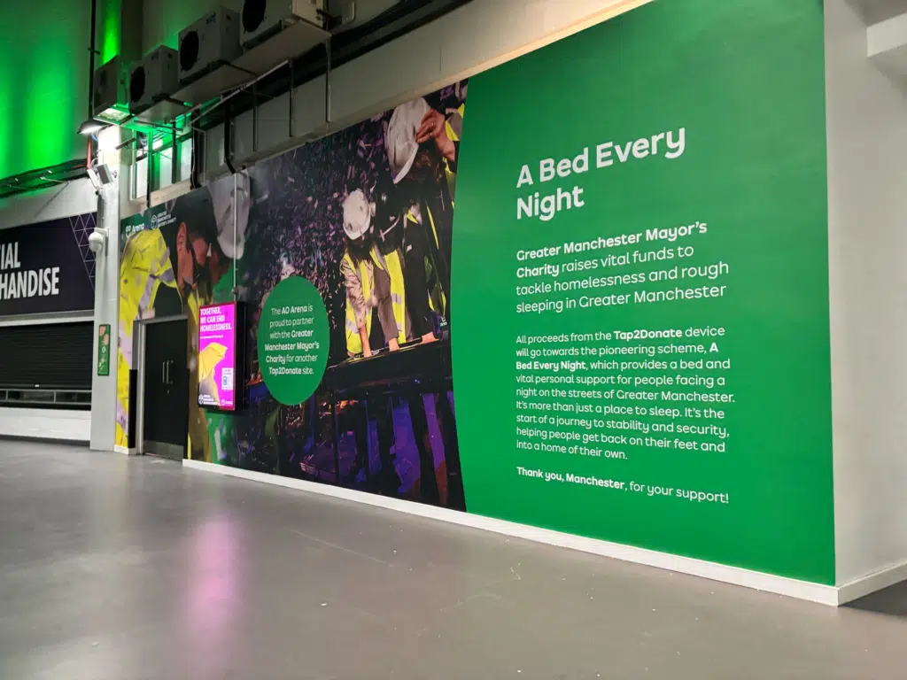 Green AO branded corridor wall graphics at AO Arena