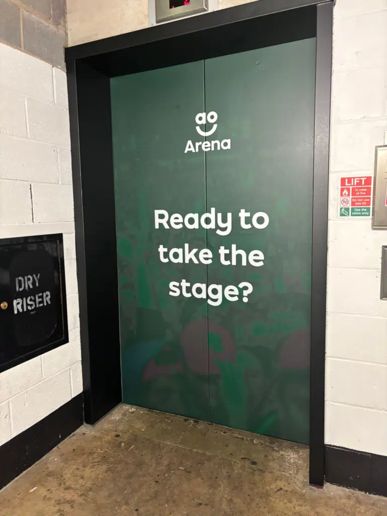 'Ready to take the stage?' door graphic at AO Arena
