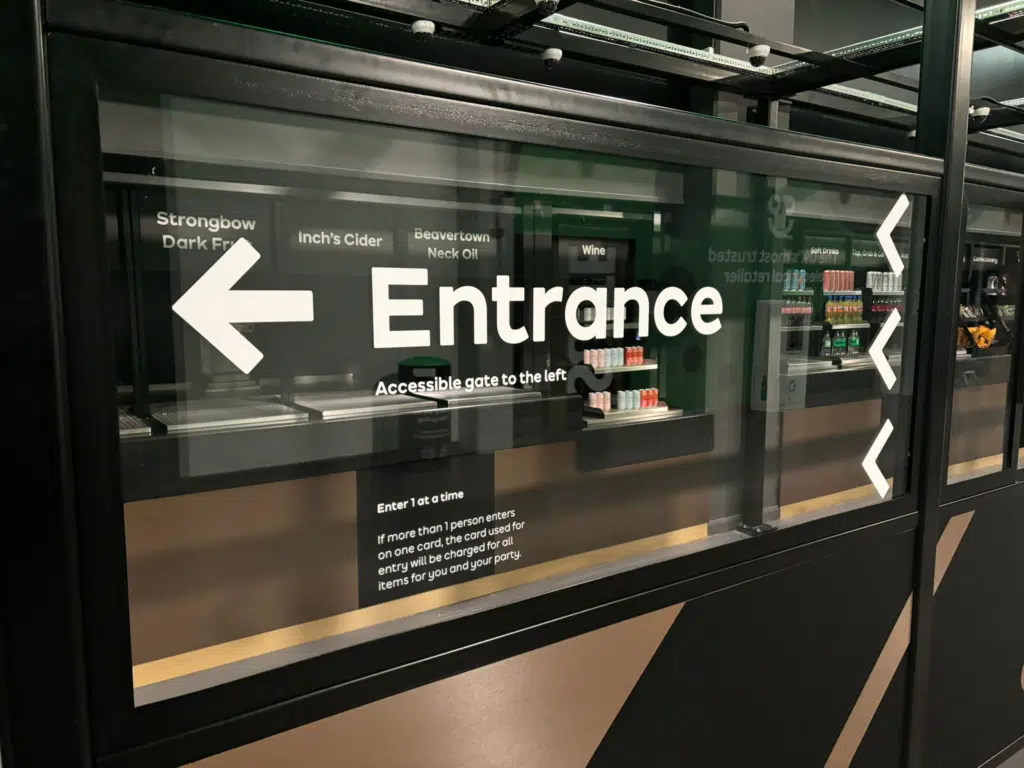 Entrance wayfinding graphics on glass at AO Arena