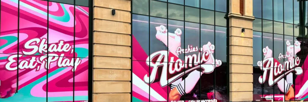Archies Atomic window graphics across a shopfront