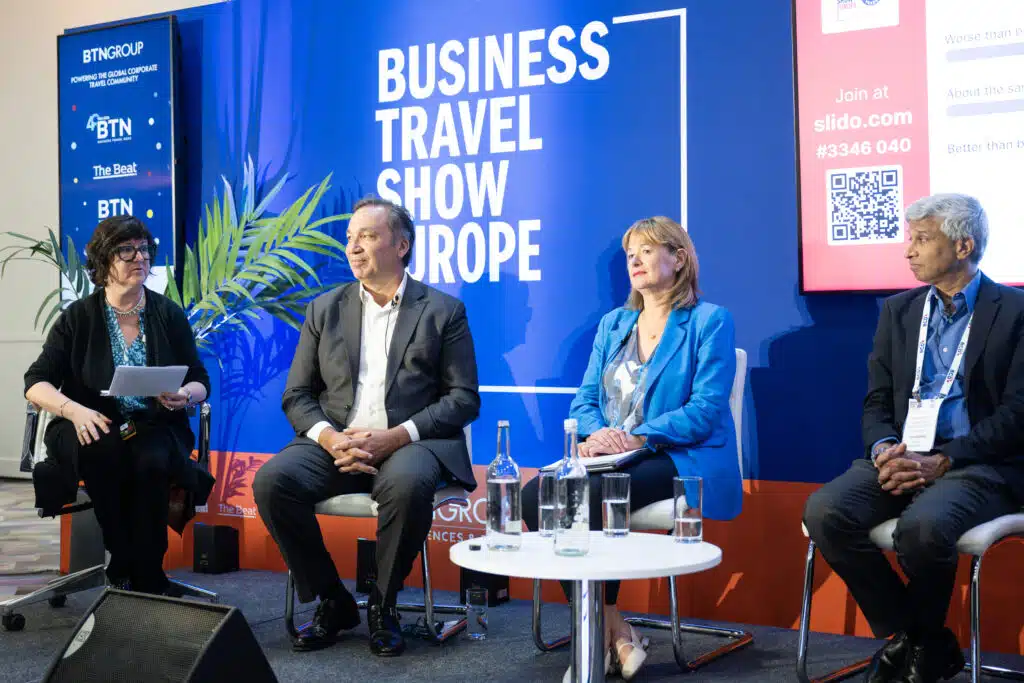 Business Travel Show Europe panel discussion stage with branded backdrop