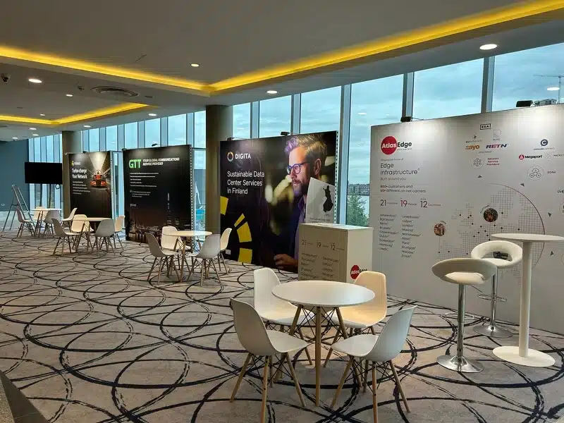 Networking area with printed graphic walls at Capacity Europe