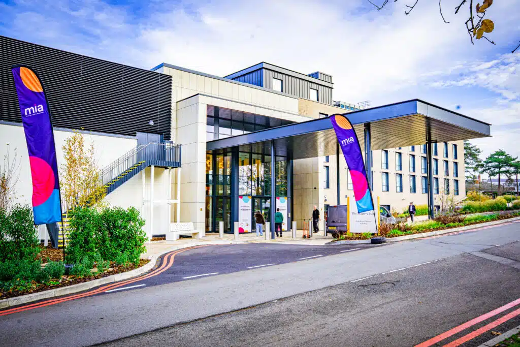 Branded flags outside the venue for the MIA Conference