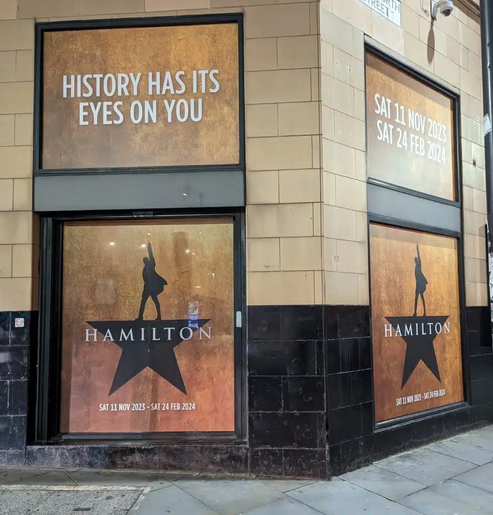 Hamilton musical window graphics on the Palace Theatre exterior