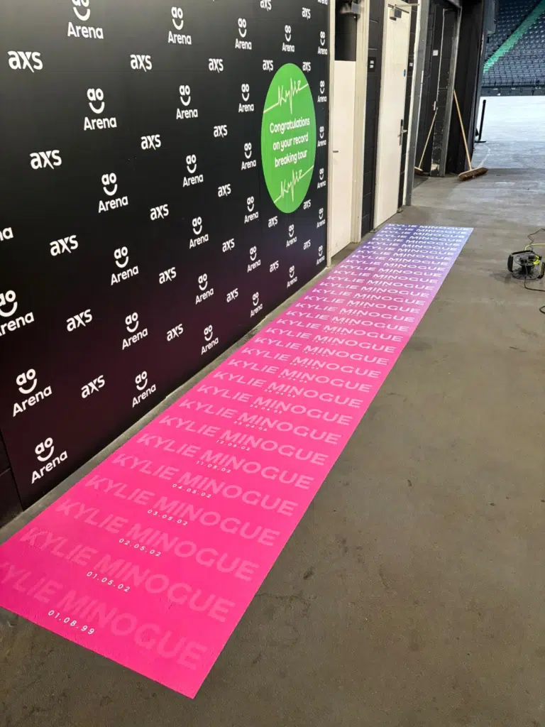 Media wall and pink floor graphics at AO Arena for Kylie Minogue