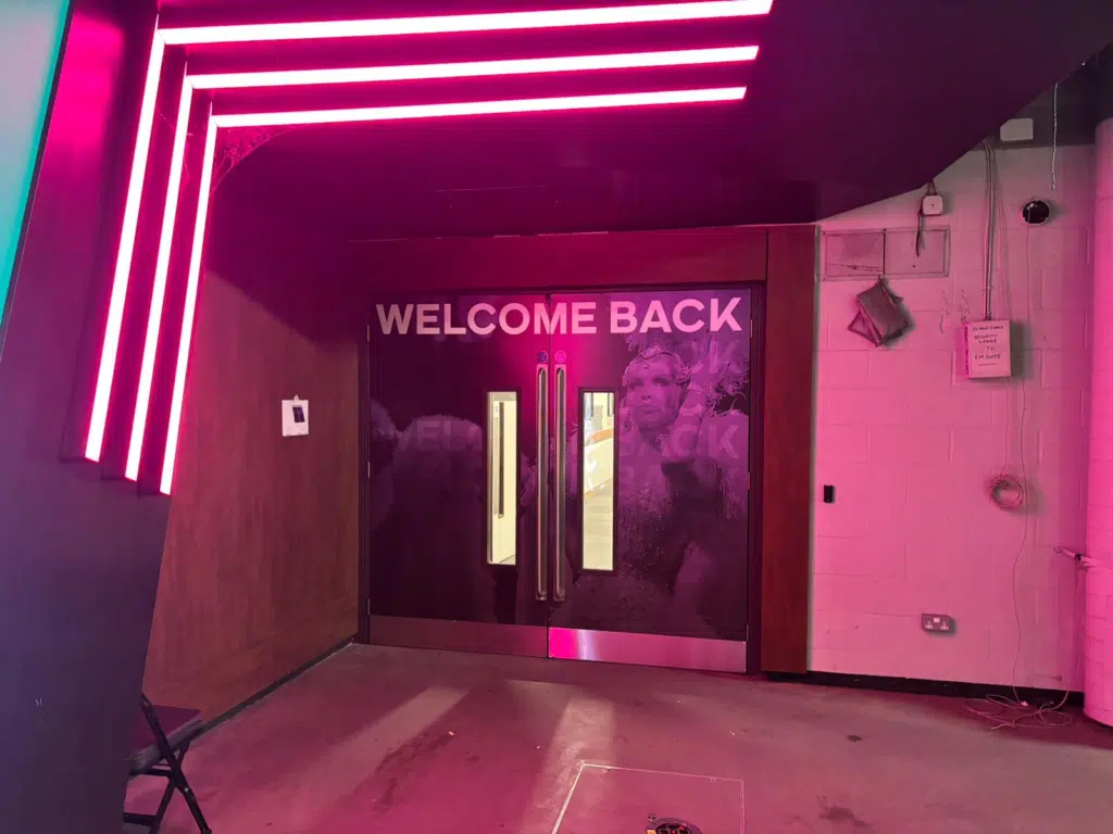 Pink neon-style 'Welcome back' entrance graphics for Kylie Minogue at AO Arena