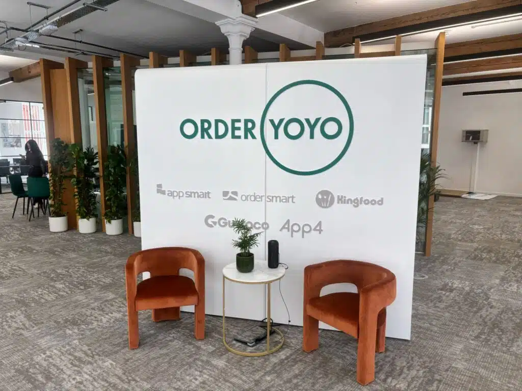 OrderYOYO branded exhibition booth with lounge seating