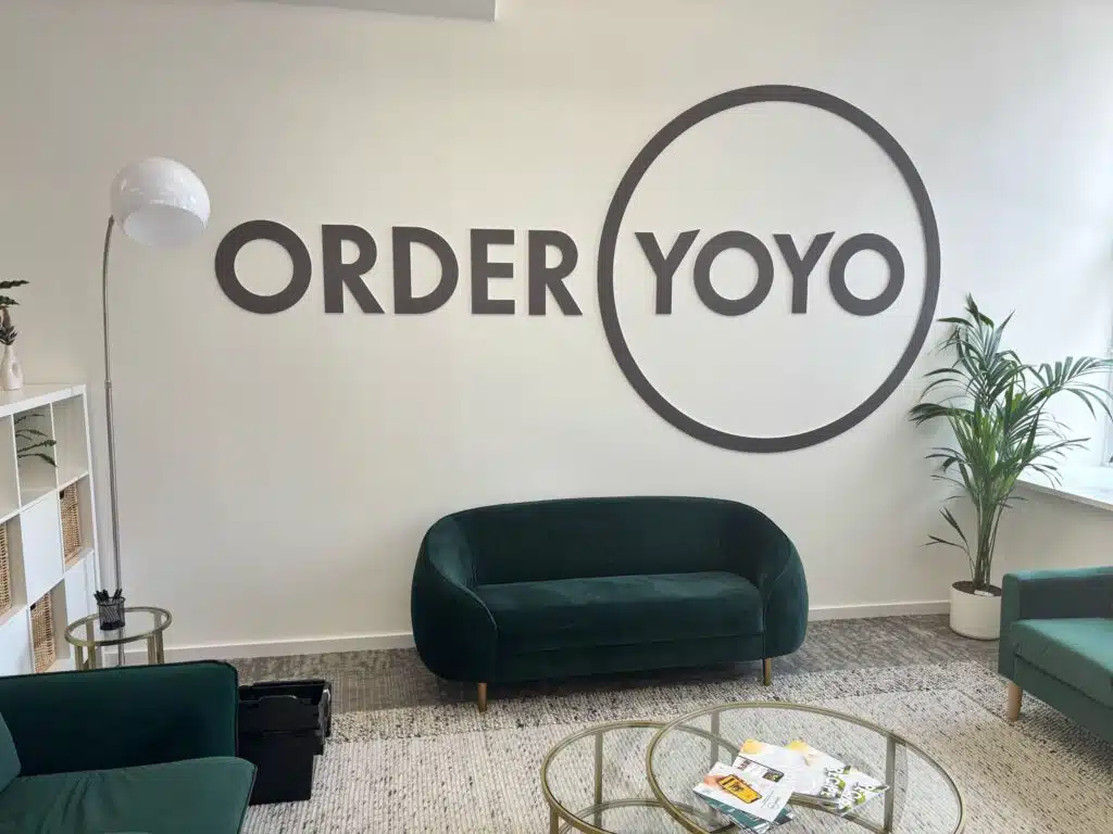 OrderYOYO logo wall graphic in an office reception