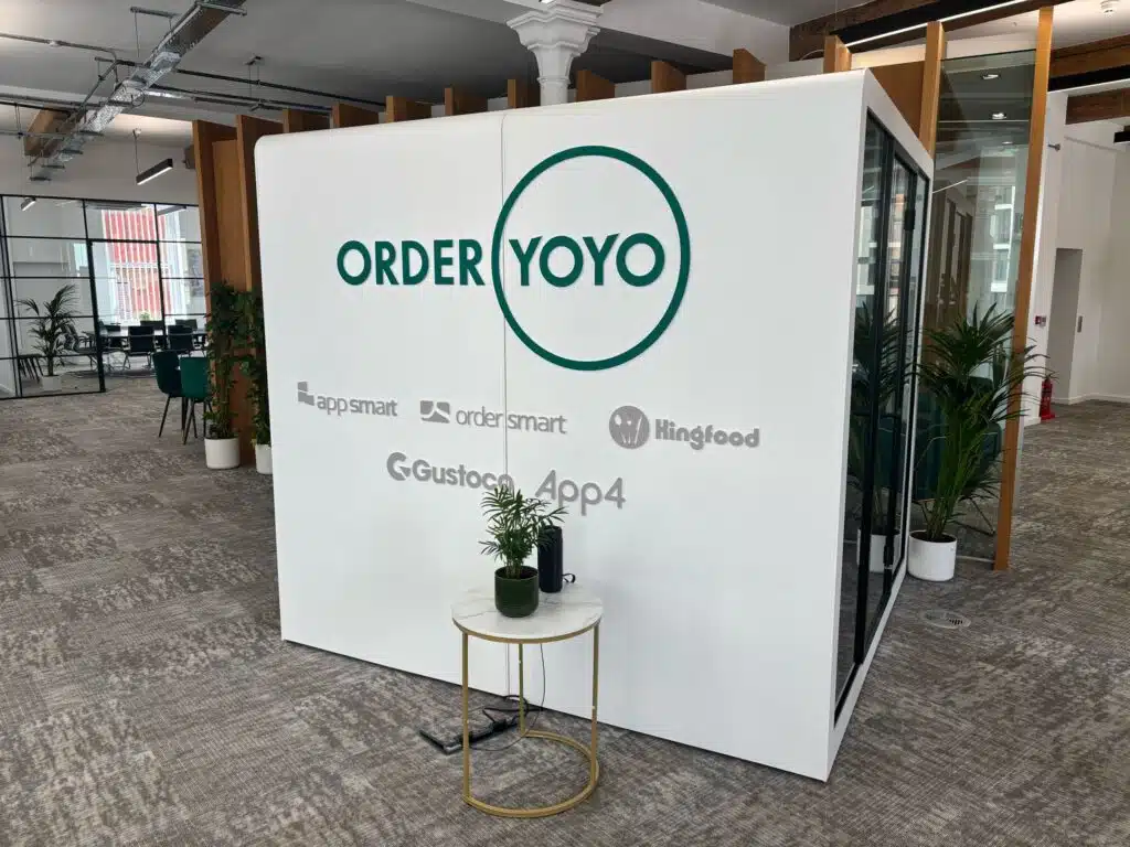OrderYOYO branded pod graphics in an open-plan office