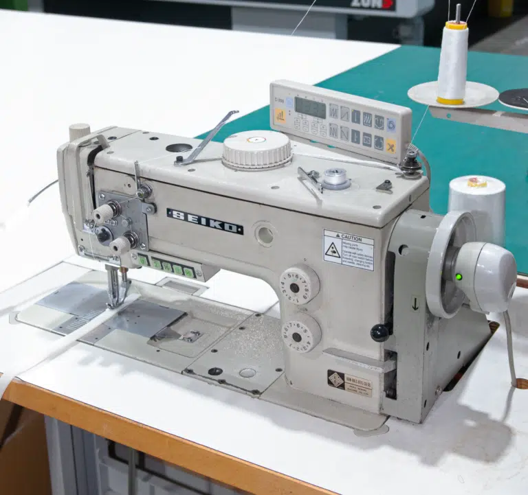 Industrial sewing machine for fabric finishing