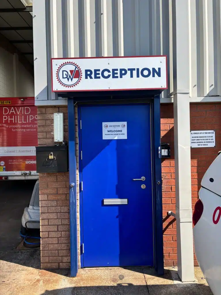 DW Motors reception door with signage