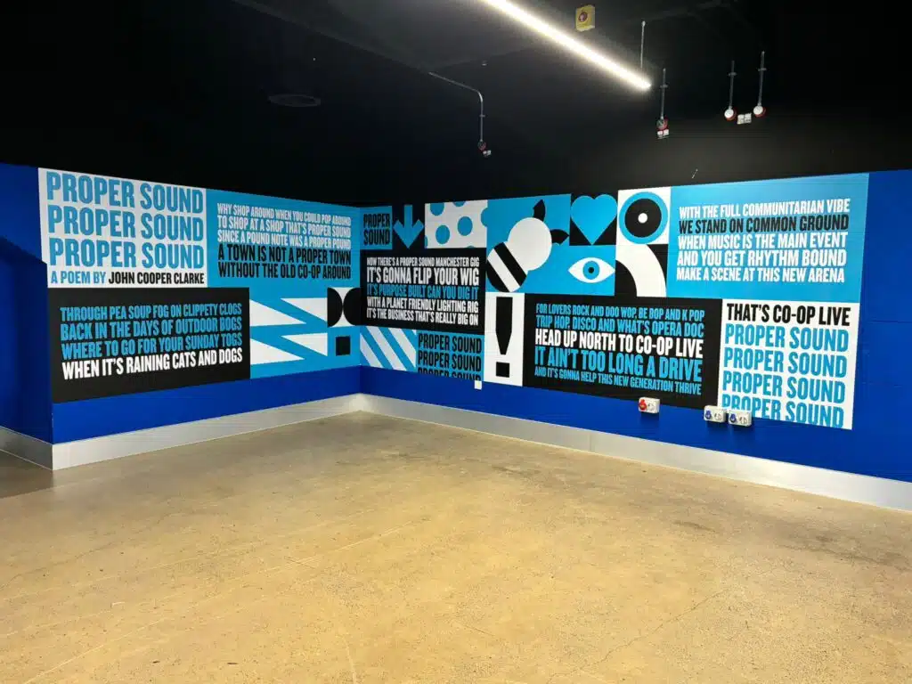 Co-op Live internal wall graphics in an arena corridor